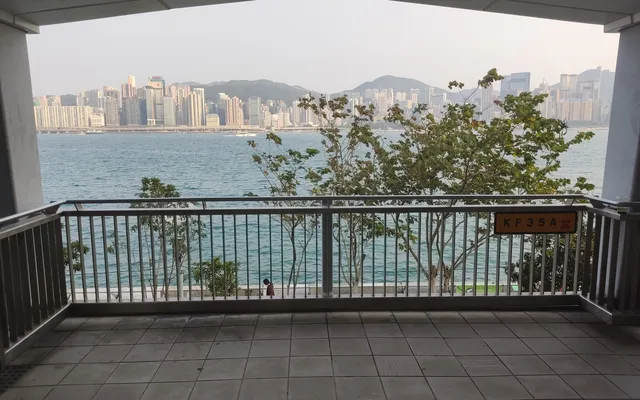 A covered viewing point on the promenade looking across the harbour