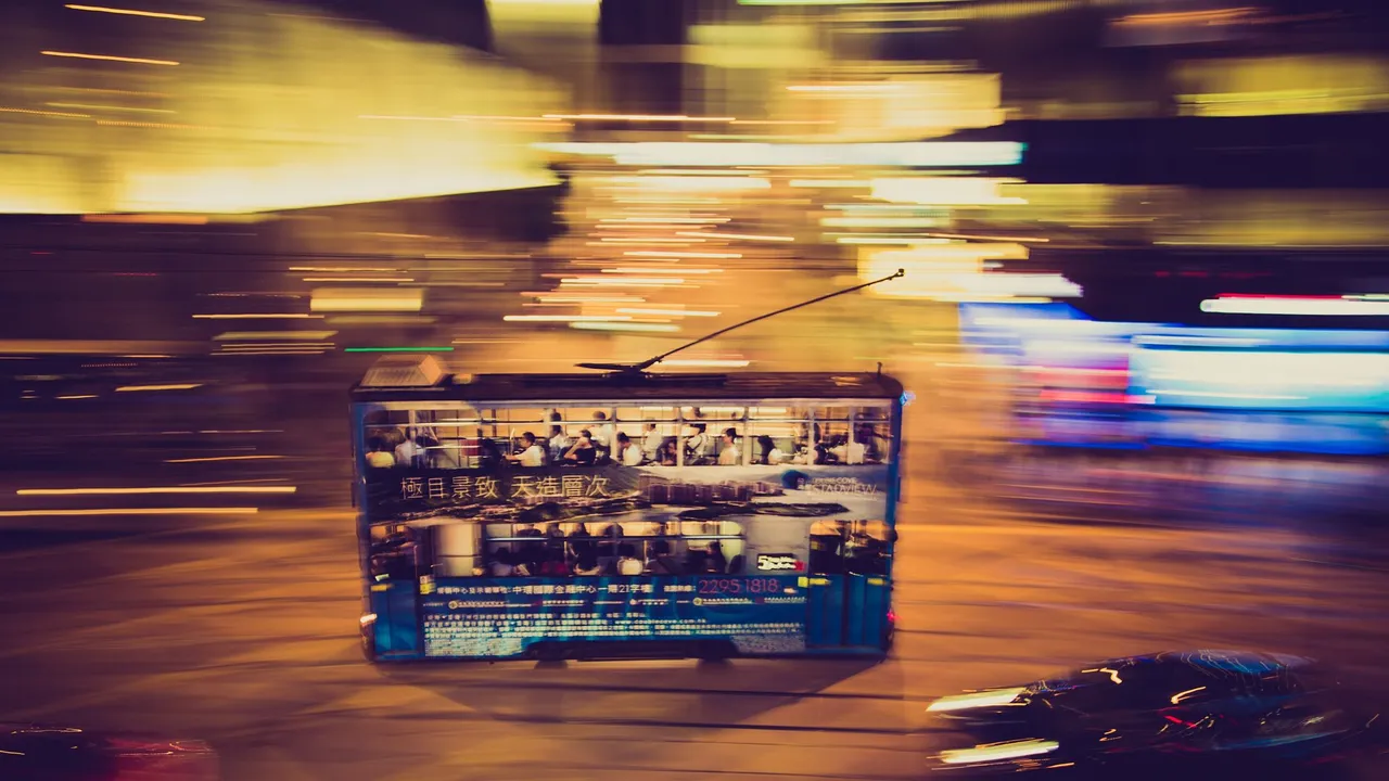 Long exposure: a tram crossing the city's light.