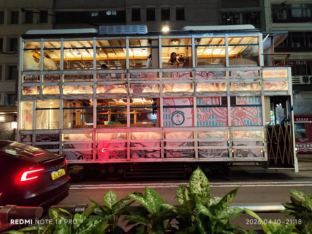 A glass-sided special car, lit from within.